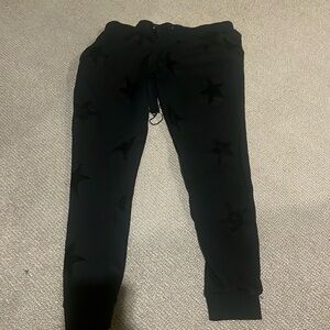 Woman’s black sweats with stars